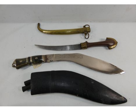 AN EASTERN DAGGER AND SCABBARD, 20CM BLADE, LENGTH 42CM AND A KUKRI KNIFE AND SCABBARD 32CM BLADE, LENGTH 45CM