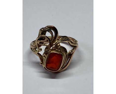 A 9 CARAT GOLD FIRE OPAL ABSTRACT RING HANDMADE BY SUSUAN VEDADI WITH A SINGLE CUSHION CUT STONE. SIZE O GROSS HALLMARKED 9 C