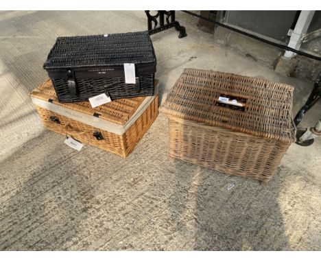 A WICKER FISHING TACKLE BASKET AND TWO HARVEY NICHOLS HAMPER BASKETS