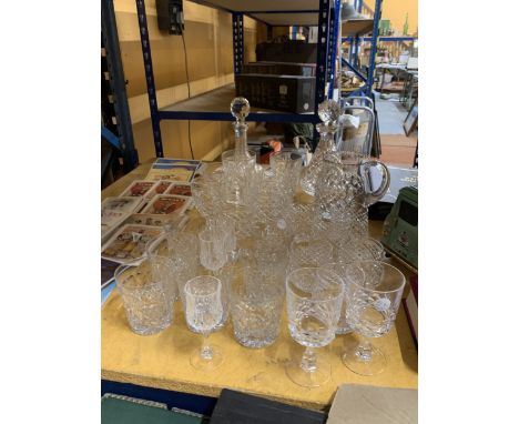 A QUANTITY OF FINE CUT GLASS LEAD CRYSTAL TO INCLUDE TWO DECANTERS, A WATER JUG, WINE GLASSES, SHERRY, TUMBLERS, ETC