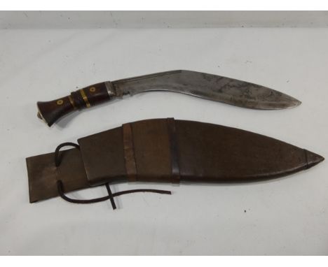 A KUKRI KNIFE AND SCABBARD 31CM BLADE, LENGTH 46CM