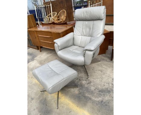 A GREY LEATHER SWIVEL RECLINER CHAIR AND MATCHING STOOL