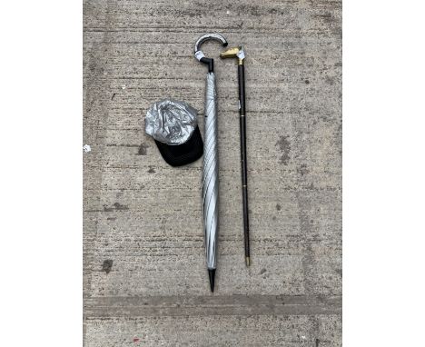 A MERCEDES BENZ CAP AND UMBRELLA AND A WALKING STICK WITH BRASS HANDLE