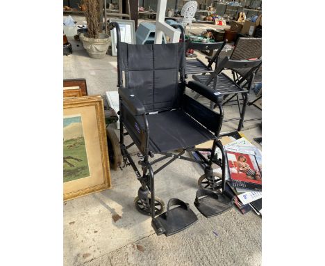 AN INVACARE FOLDING WHEELCHAIR