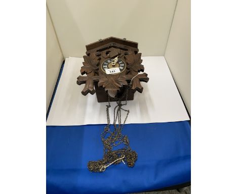 A BLACK FOREST STYLE CUCKOO CLOCK