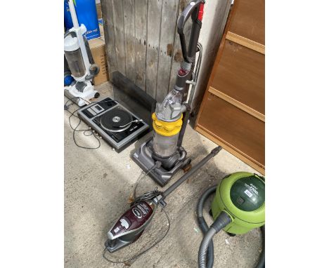 A DYSON VACUUM CLEANER AND A SHARK STICK VACUUM