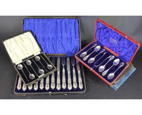 A cased set of Edwardian silver handled fruit knives and forks, George Henry Biggin Sheffield 1905, along with a a cased set 