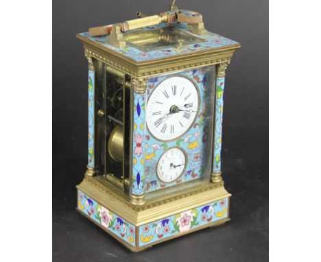 A Continental champleve enamel and brass repeating alarm carriage clock, with Roman numeral dial above alarm selector, on pli