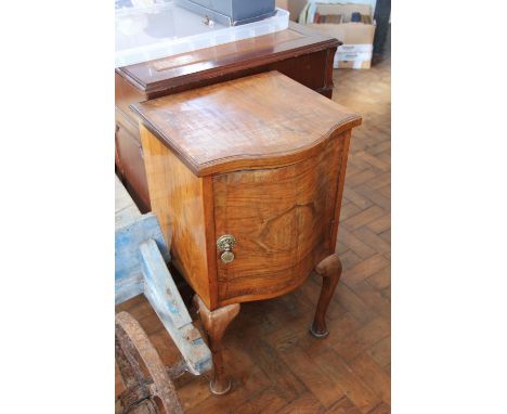 A 1930's walnut bow front pot cupboard, on cabriole legs, 72cm; an oak two tier table, 159cm and a bed post standard lamp (3)