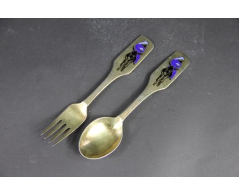 An A. Michelsen Danish silver gilt fork and spoon dated 1966, enamelled with a view of Mary riding a donkey, 'Jul 1966 A Mich