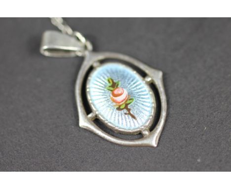 A Charles Horner silver and enamel pendant, decorated with a rose, with lapel chain, initialled CH verso, 2.5cm 