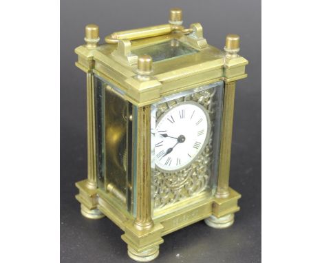 A French gilt brass carriage time piece, enamel dial with Roman numerals and pierced white metal surround, case initialled, 1