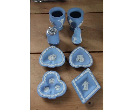 Eleven pieces of Wedgwood blue jasper cameo wares, to include a pair of vases, pin dishes, a table lighter etc (11)