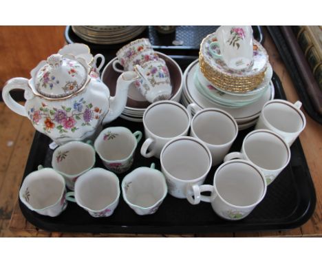 A Shelley china twelve piece part coffee set, decorated with roses; a Spode Lauriston pattern thirteen piece part tea set; an