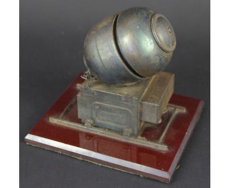 A Gentleman's Club lighter modelled as a World War II 500lb mine on a rail carriage, on rectangular base, 15cm x 13cm