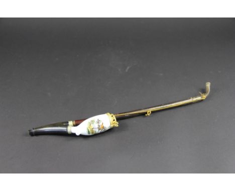A 19th century German porcelain pipe, the bowl painted with a horse, with a gilt metal lid cast with a horse (crack), 34cm