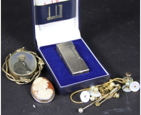 A Dunhill silver plated cigarette lighter, in original case with booklet; with a cameo brooch, and other items