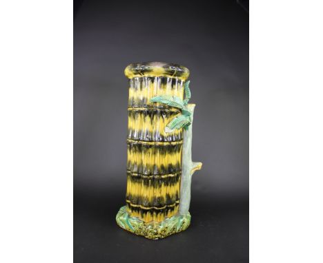 A late 19th century majolica stick stand, modelled as a bound group of bamboo, some chips, 60cm