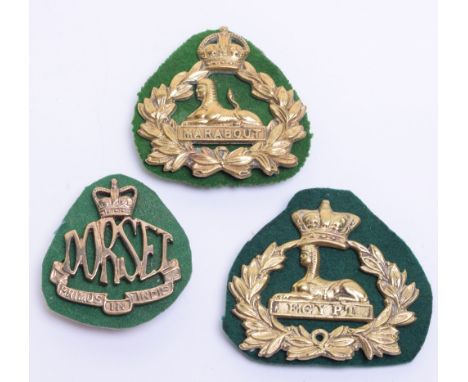 Three Dorsetshire Regiment Band Pouch Plates, consisting of Victorian example being Sphinx within wreath surmounted by Victor