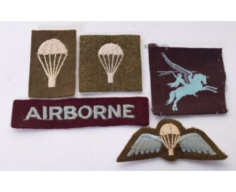 WW2 British Airborne Insignia consisting of straight pattern embroidered Airborne title, printed Pegasus formation sign, padd