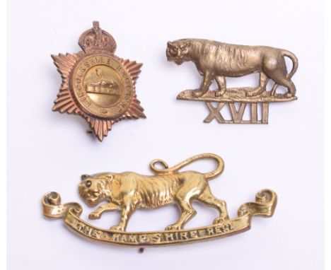 Three Regimental Band Pouch Plates, consisting of cast brass Leicestershire regiment example being a tiger standing over XVII