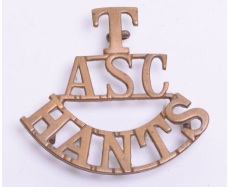 Great War Army Service Corps Territorial Shoulder Title, brass T/ASC/HANTS with three lug fittings on the reverse. Remains in