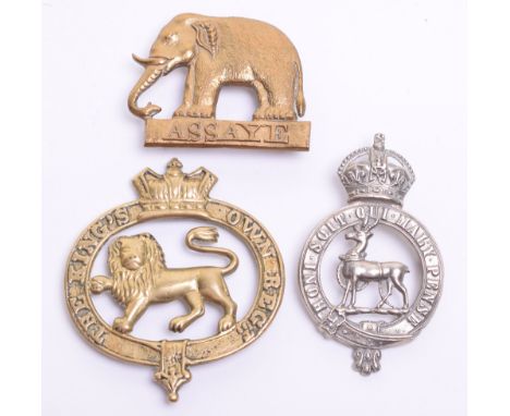 Three Regimental Band Pouch Plates, consisting of crude brass Victorian crowned example for The Kings Own Regiment with four 