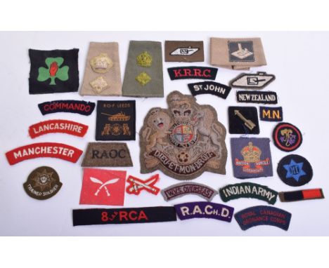 Selection of Cloth Insignia consisting of large embroidered khaki RSM arm badge, embroidered white on black New Zealand slip 