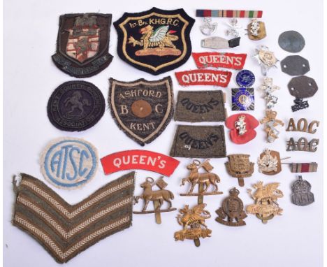Selection of Badges and Insignia consisting of printed Queens Regiment shoulder title, pair of WW1 period white on red embroi