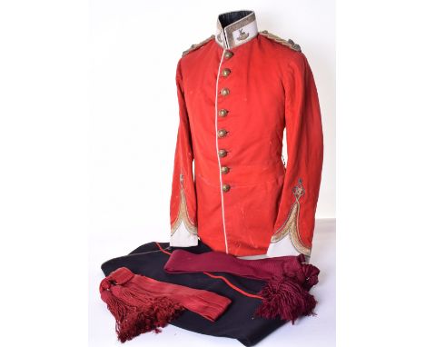 Bedfordshire Regiment Officers Dress Uniform, tunic of scarlet cloth with white facings to the collar and cuffs. Gilt tress d