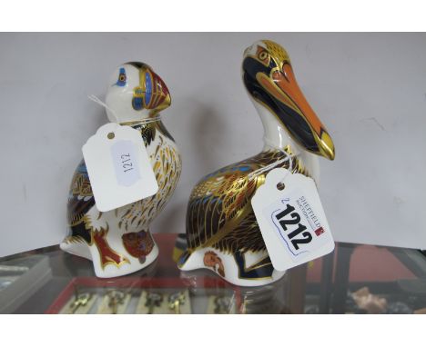 Royal Crown Derby Paperweights 'Brown Pelican', 13cm high and 'Puffin' 12cm high, both gold stoppers, first quality. (2)