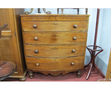 XIX Century Mahogany Bow Front Chest of Three Graduated Drawers, having turned handles, shaped apron and turned legs, 104.5cm