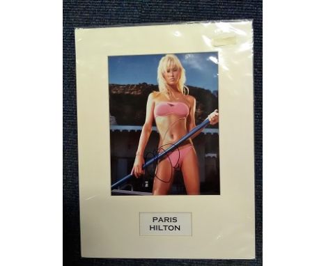 Paris Hilton signed colour photo.  Mounted.  American businesswoman, socialite, television and media personality, model, actr