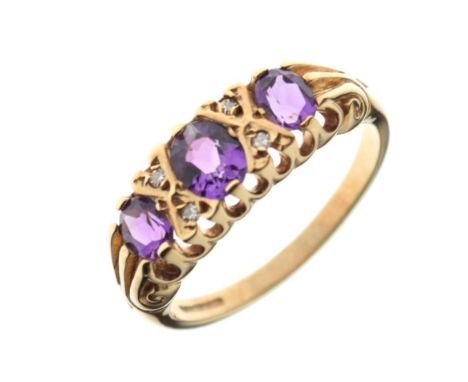 9ct gold dress ring set three amethyst-coloured stones and four small white stones, size M, 2.5g gross approx Condition: **Du