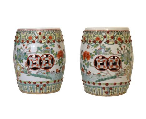 Two 20th Century Chinese porcelain barrel shaped garden seats, foliate decoration, on a white ground, 37cm high Condition: Lo