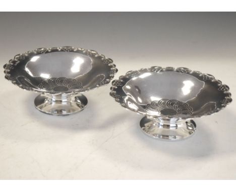 Pair of George V silver pedestal bowls, Sheffield 1933, 13cm diameter, 165g approx Condition: Slightly out of shape and with 