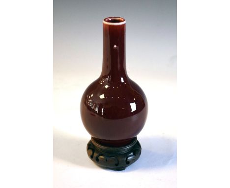 Chinese sang de boeuf vase with four character underglaze mark to base, on carved hardwood stand, 17cm high Condition: Pock m