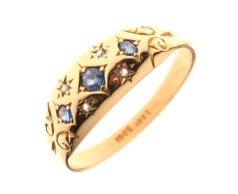 Yellow metal dress ring set three sapphires and four small gypsy-set diamonds, shank stamped '18ct', size T, 3.5g gross appro