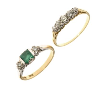 Yellow metal, emerald and diamond three-stone ring, the central square-cut emerald between two small brilliants, shank stampe