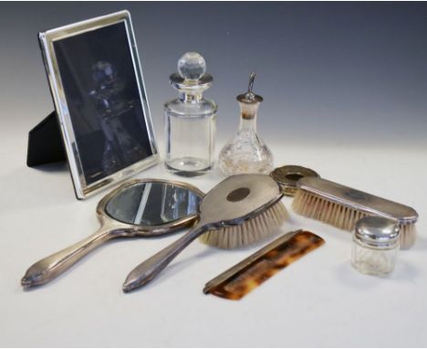 Quantity of silver items to include Elizabeth II four piece silver-mounted dressing table set with engine turned decoration, 