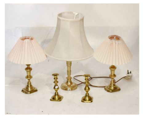 Three brass table lamps, together with two brass candlesticks Condition: Lamps not tested, and not guaranteed, sold as seen, 