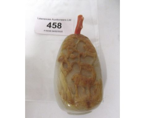 Chinese white and russet jade snuff bottle, carved with a bird and a deer in landscapes, with a coral stopper, 80mm high incl