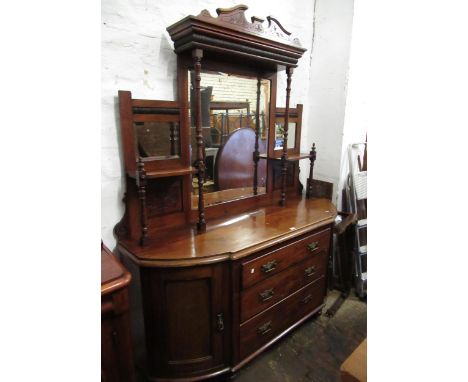 Victorian mahogany semi-bow fronted sideboard, with a mirrored shelf back above three centre drawers, flanked by a pair of do