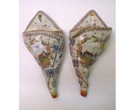 Pair of Quimper pottery wall pockets, together with a group of six pottery figural decanters