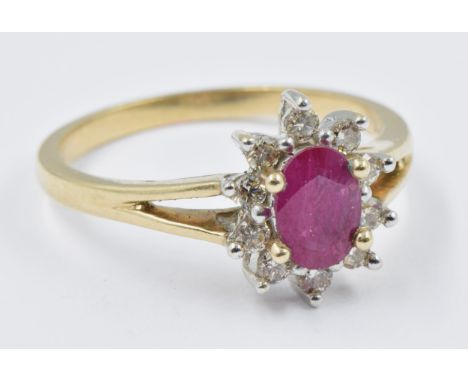 9ct Gold oval ruby and diamond cluster ring, size R, 3.4gHallmarked 375