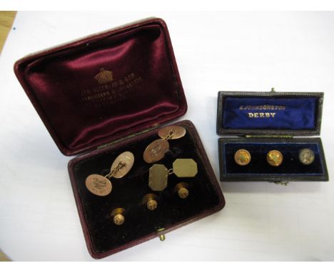 9ct yellow gold cufflink and button set in original box, another 9ct cufflink, and a boxed yellow metal three button set, 12.