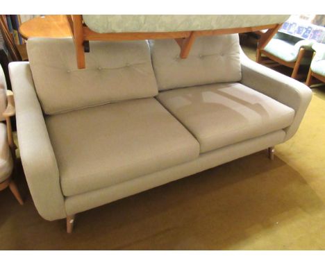 Modern two seat sofa in mid century style, on turned tapering splayed supports