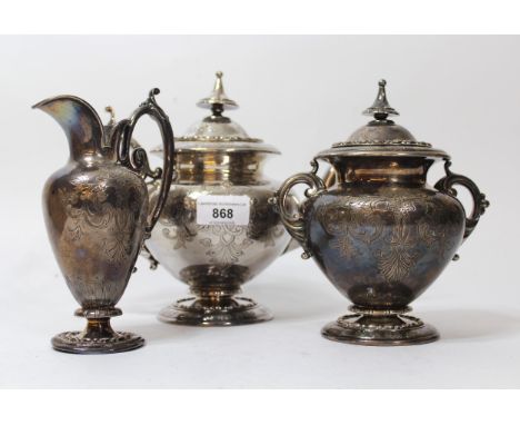 19th Century Continental white metal three piece tea service with engraved floral decoration and crests, 47.5oz t