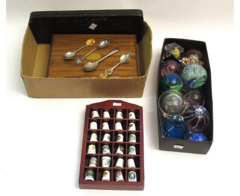 Quantity of glass paperweights, together with a quantity of ceramic thimbles and a small quantity of silver plated flatware
