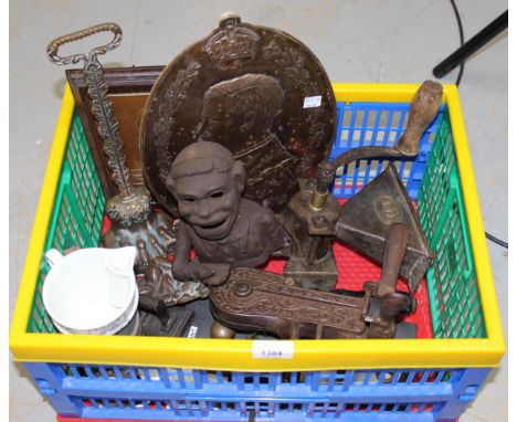 Box containing a cast iron money bank, an American bar top corkscrew, pay-to-enter door lock, and other miscellaneous metalwa